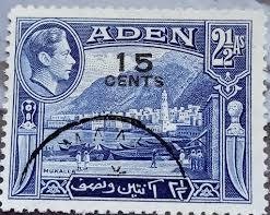 The same blue Mukalla stamp overprinted 15 CENTS, used, with a curved postmark